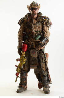  Ryan Miles in Junk Town Postapocalyptic Bobby Suit holding gun standing whole body 0001.jpg
